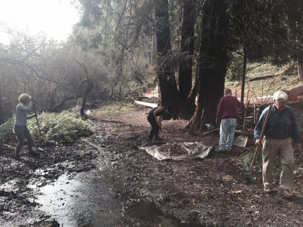 How the creek looked before children and Rec & Park volunteers finished working. This photos shows Alison Draper, Steve Uchida, Jim Hanratty and Sam Orr working to clear Islais Creek of debris.