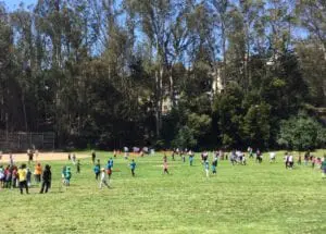 kids playing ball field
