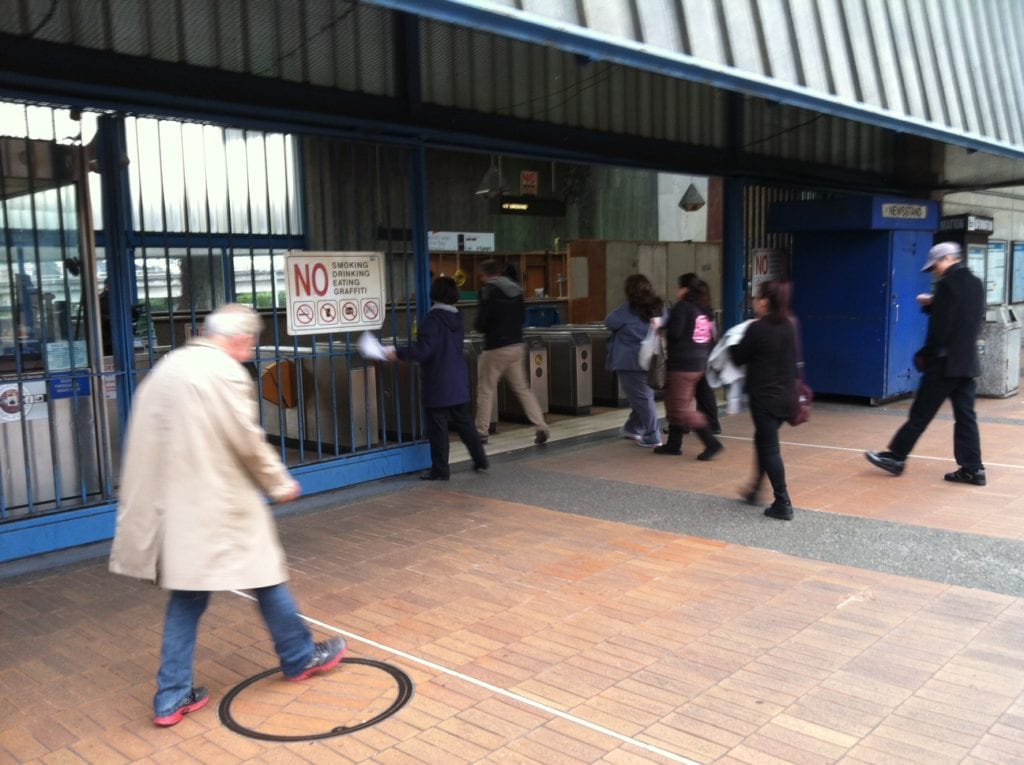 People entering the BART station after it was closed for two hours due to a death on the tracks. Photo by Carolyn Deacy.