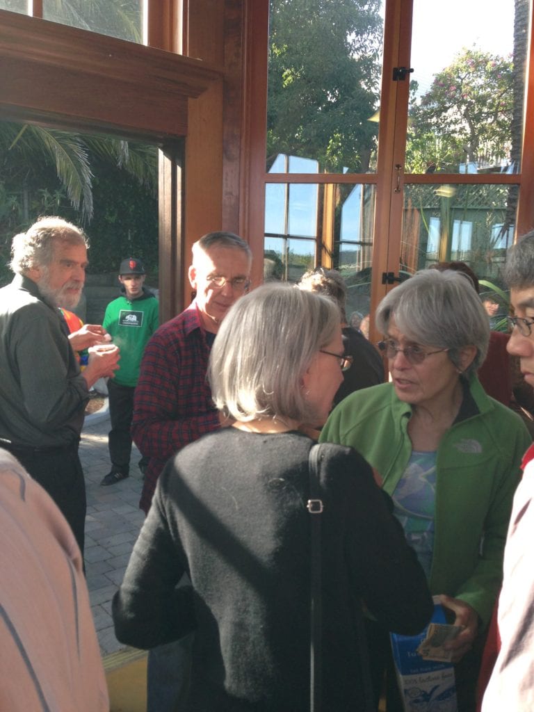 Sally Ross chatting with a neighbor at intermission during the Temescal String Quartet performance at the Sunnyside Conservatory. Photo by Bill Wilson.