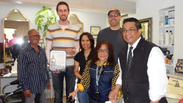 Scott Wiener Certiicate of Honor to Glory Dalere. Her daughter Marian and Ric Lopez, Glen Park Merchant Association president look on. Photo by Mary Ann Gaoaen.