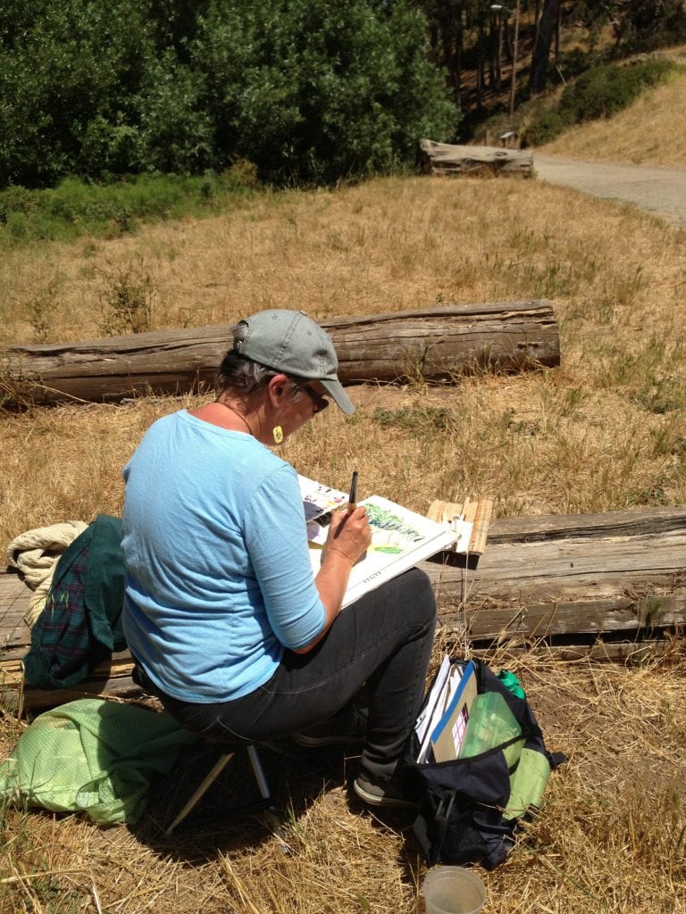 Boz Verbrugghe, enrolled in a CCSF watercolor class, paints in Glen Canyon on June 19, 2013. Photo by Murray Schneider.