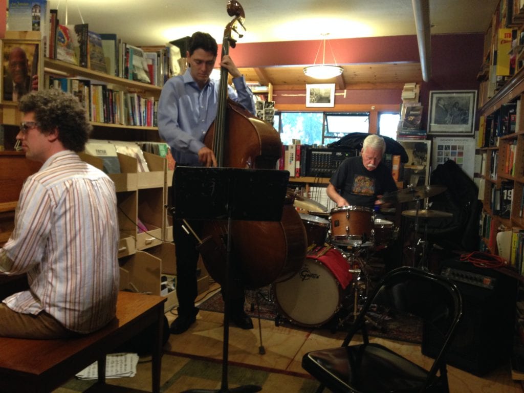 Michael Parsons on piano, Ollie Dudek on bass and Jimmy Ryan on drums, performing at Bird and Beckett's rent party.