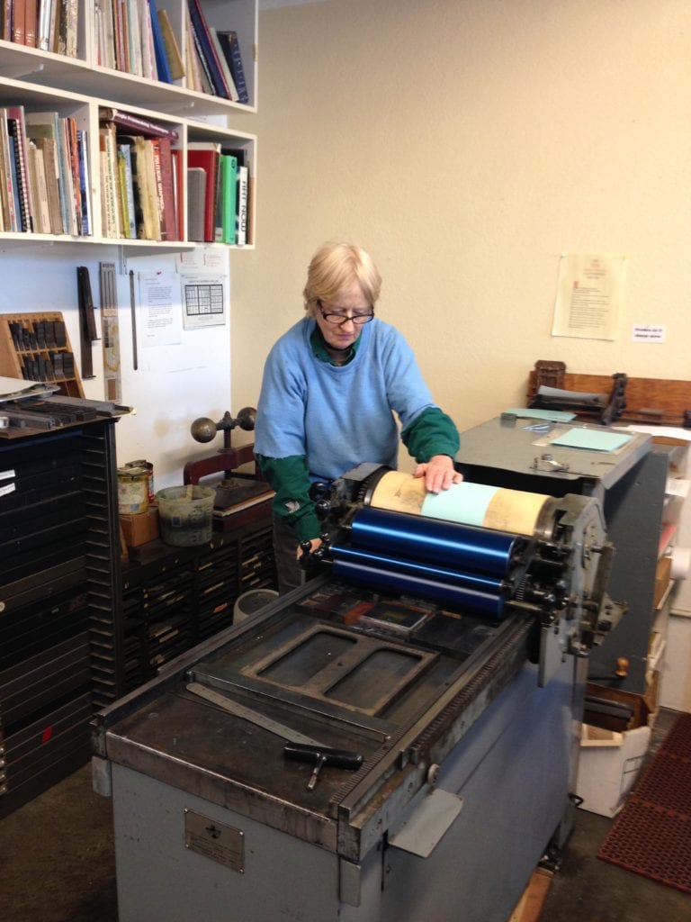 Mary printing Christmas card.