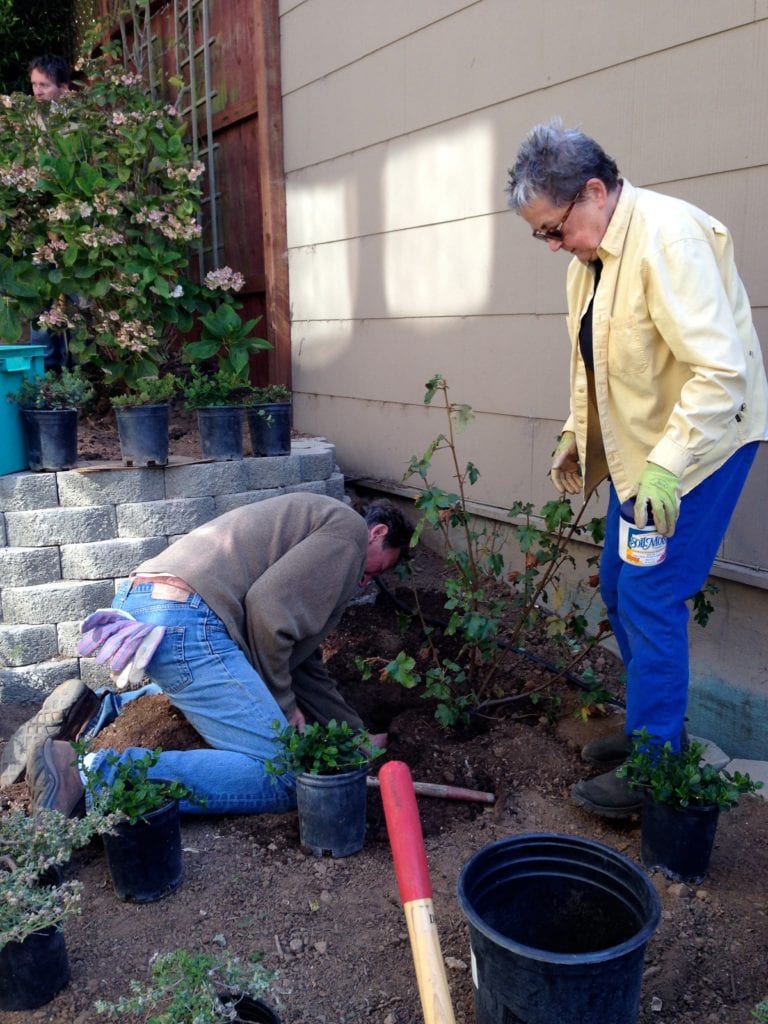 Adam King and Kay Hamilton Estey working along Surrey Street steps.