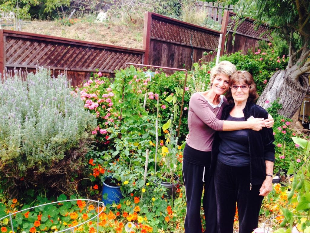 Emily and her daughter Holly in her garden on Arbor Street