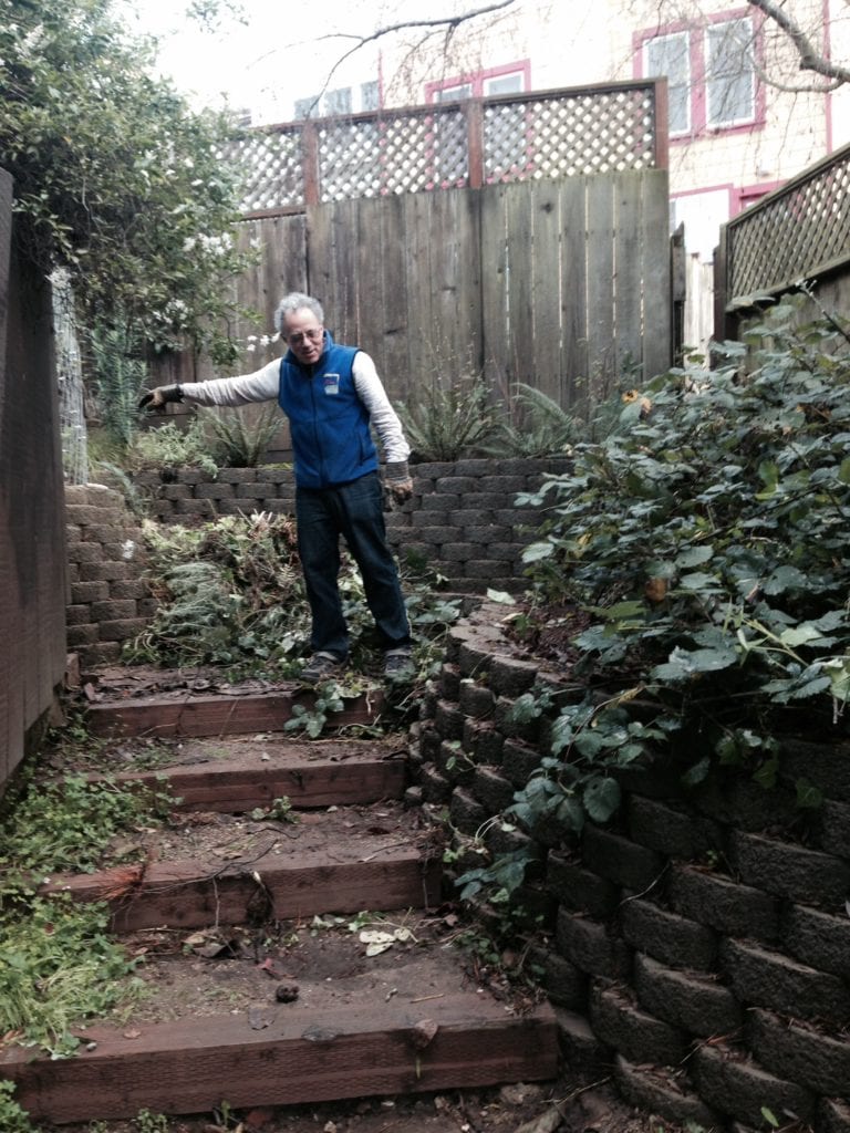 Michael Rice surveying his work and recently constructed box steps that need repair