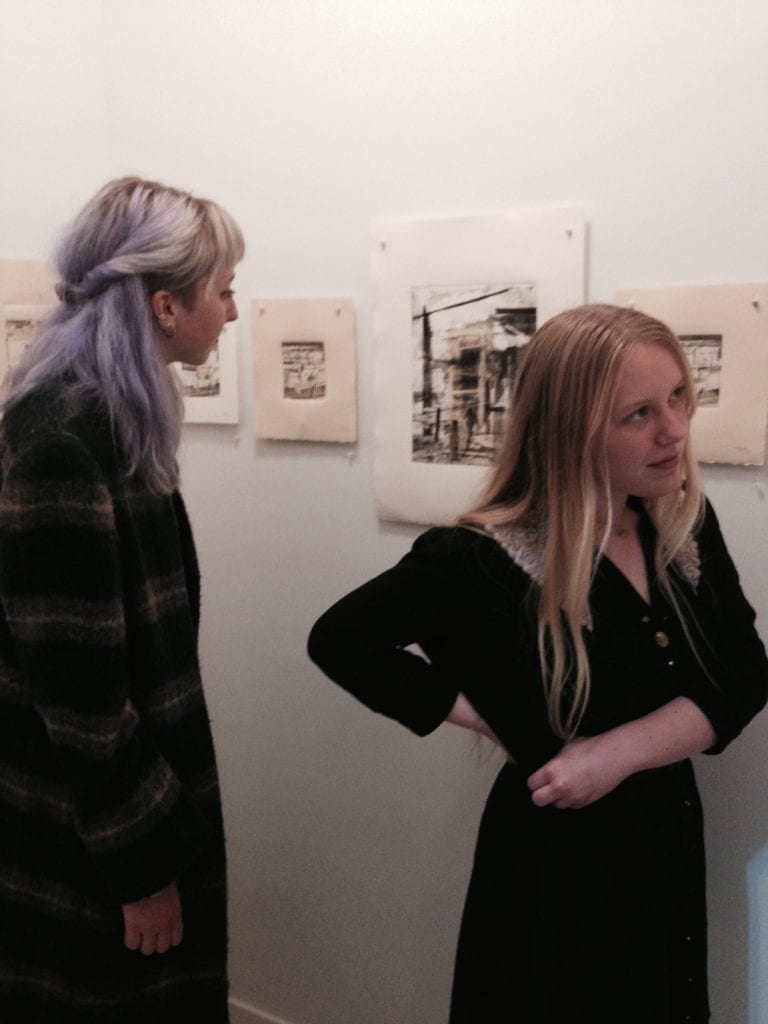 Lilly Hope and Megan Corkill, taking in Robbie Sugg's prints at Gallery Ex Libris. February 7, 2015.