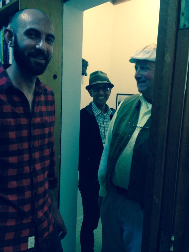 Curator Jack Whittington, artist Greg Adams and visitor enjoying Gallery Ex Libris' third show since it opened its door.