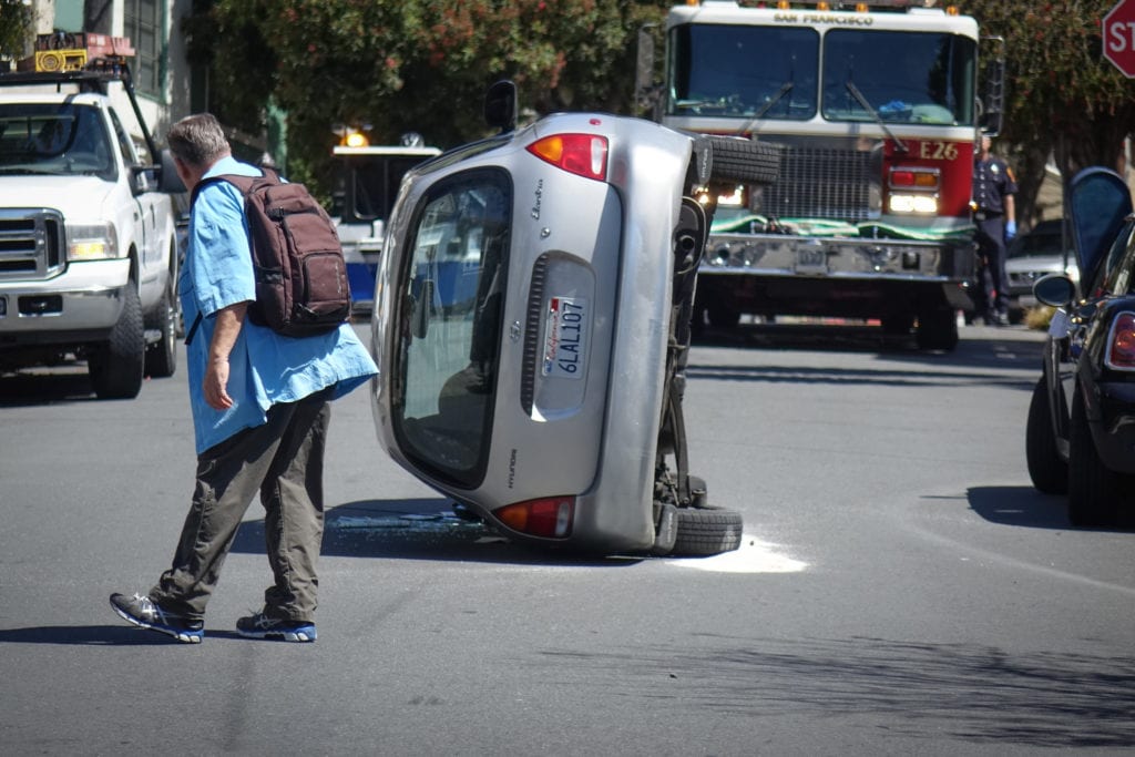 A car on is on its side after an accident on Diamond Street near Surrey Street in San Francisco. Photo: Liz Manglesdorf