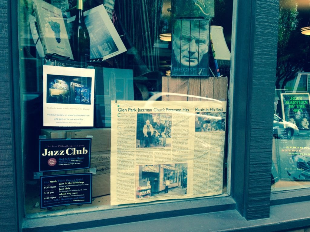 Bird & Beckett book store window, featuring a Chuck Peterson Glen Park News story 
