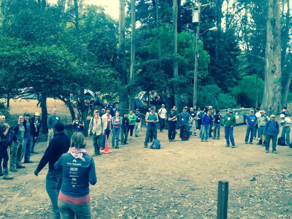 One hundred and twenty five V-O-Cal volunteers assemble at 8 a.m, Saturday, July 18, 2015, on Alms Road, ready to begin week end trail work.