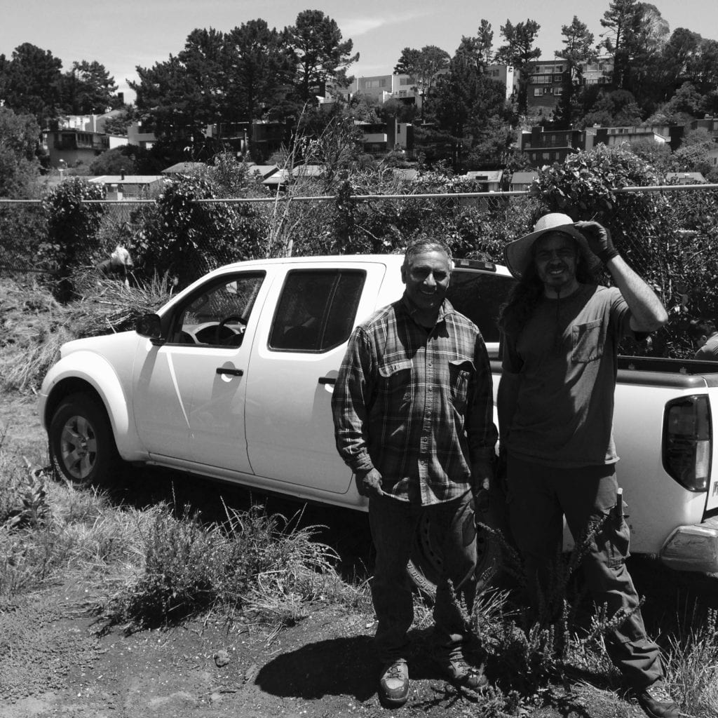 School Farm beekeeper Fernando Aguilar and ECOSF Program Director Sam Hartman.