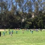 kids playing ball field