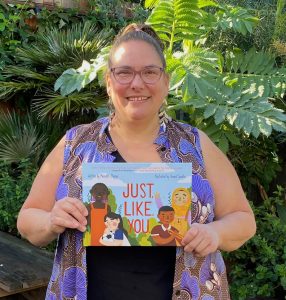 Meredith Steiner holds her book "Just Like You"